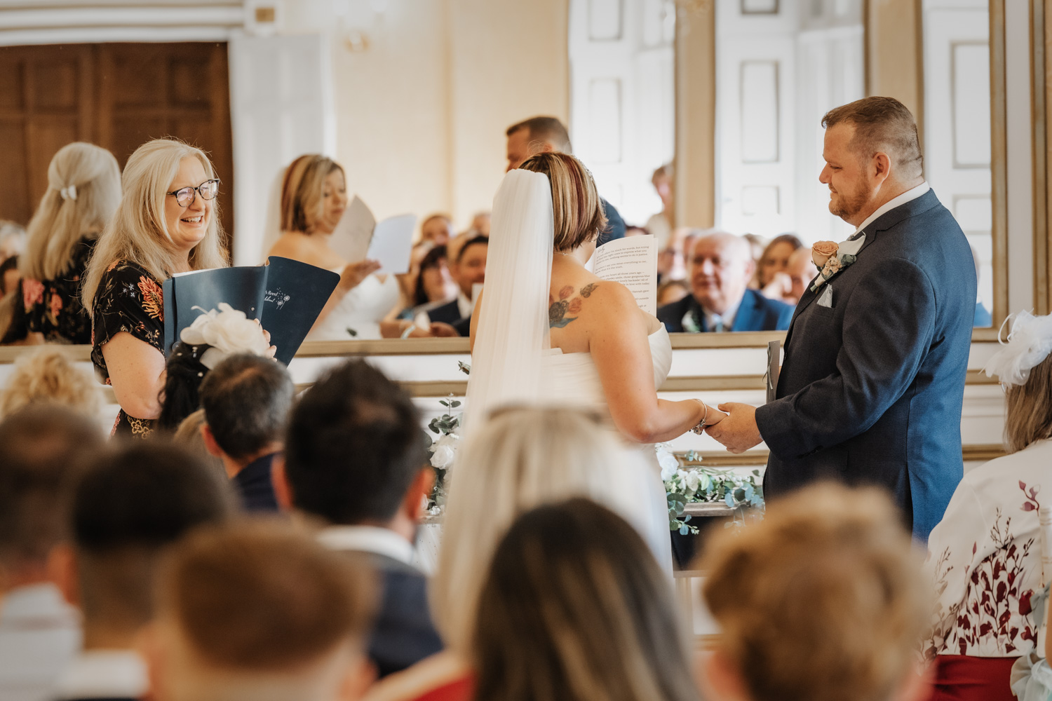 Deb Reed Celebrant Colchester Essex, playing the Mr & Mrs paddle game at the vowel renewal of Gary and Kelly.